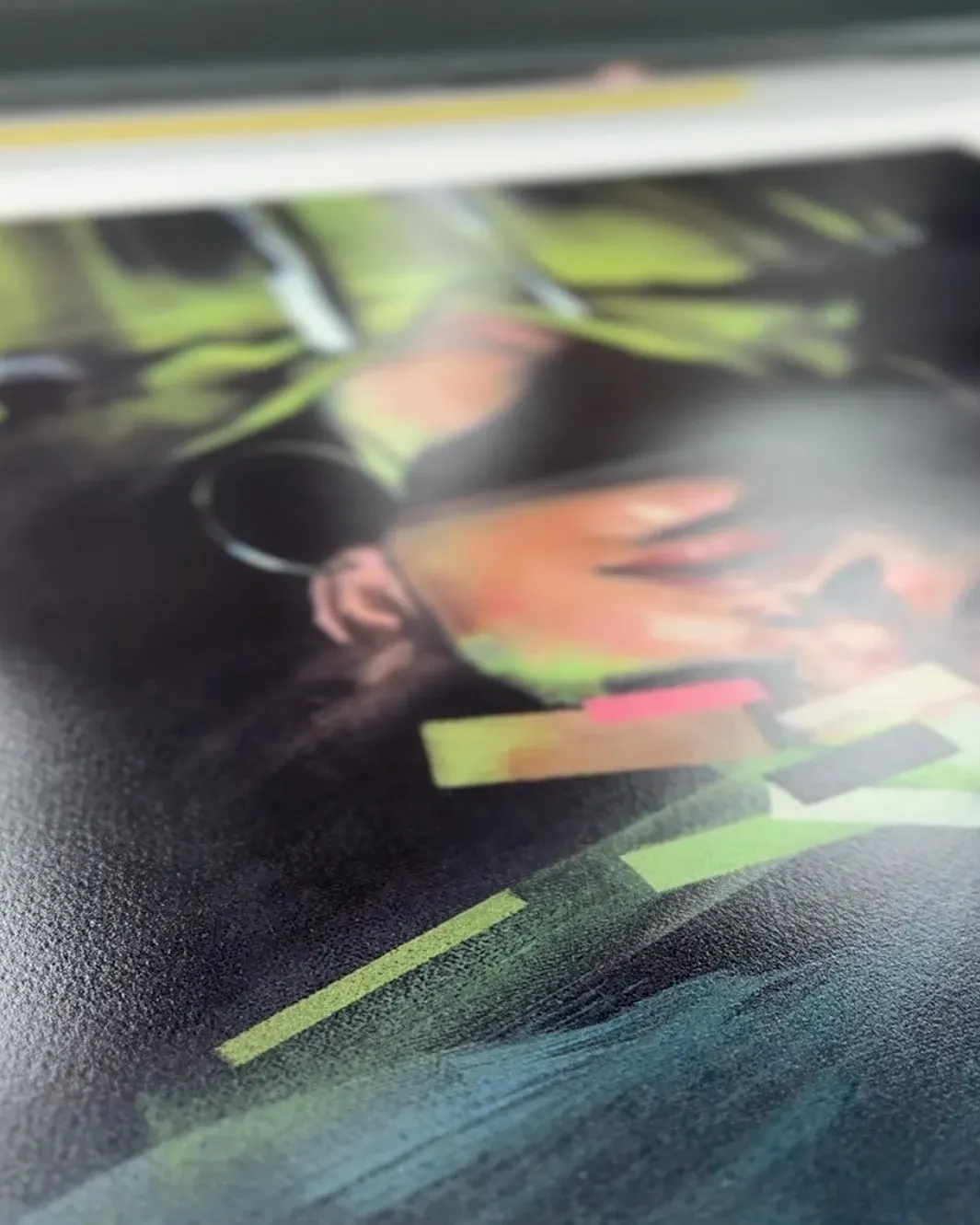 Close view of a glossy printed surface catching the light