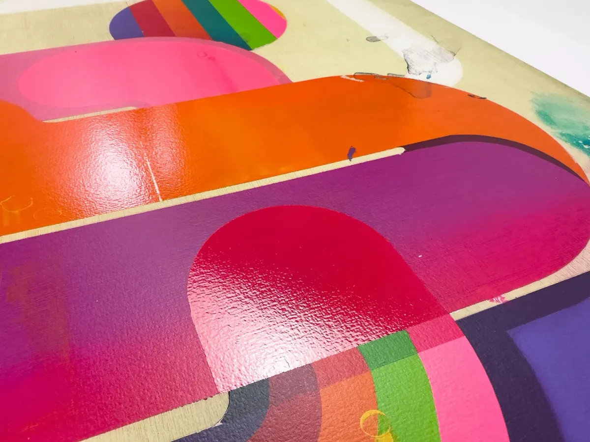 Bright pink, orange and purple shapes in a layered screenprint